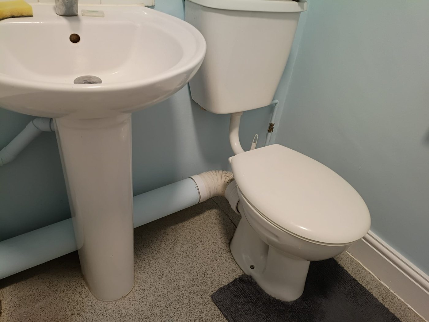 Bathroom walls painted in a custom-matched pale blue with white woodwork, Little Common